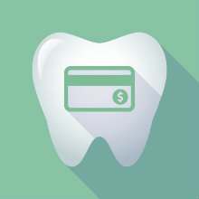 A tooth with a green credit card on a green background